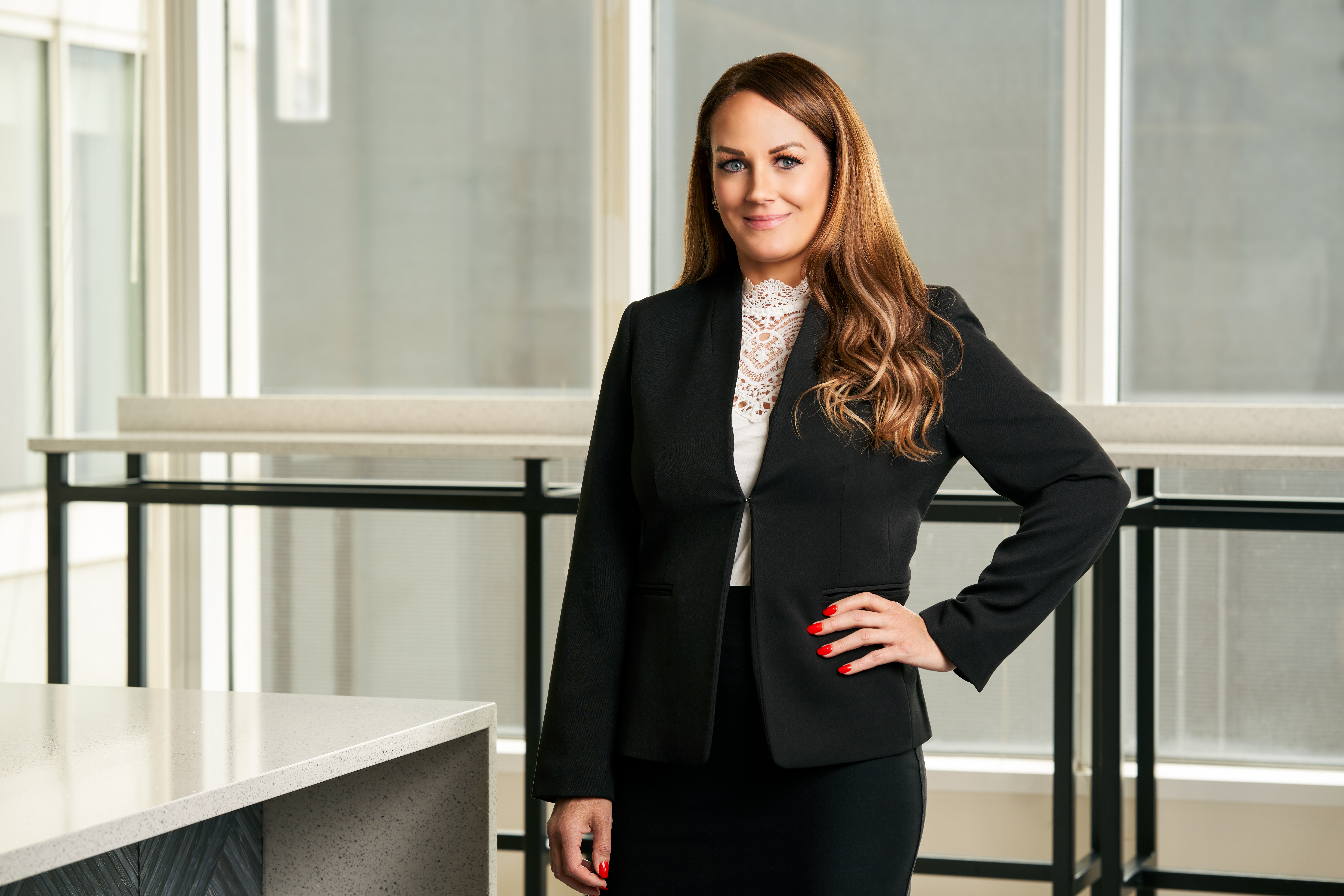 Chicago injury attorney, Jennifer L. Ashley, standing in the office of Salvi, Schostok & Pritchard